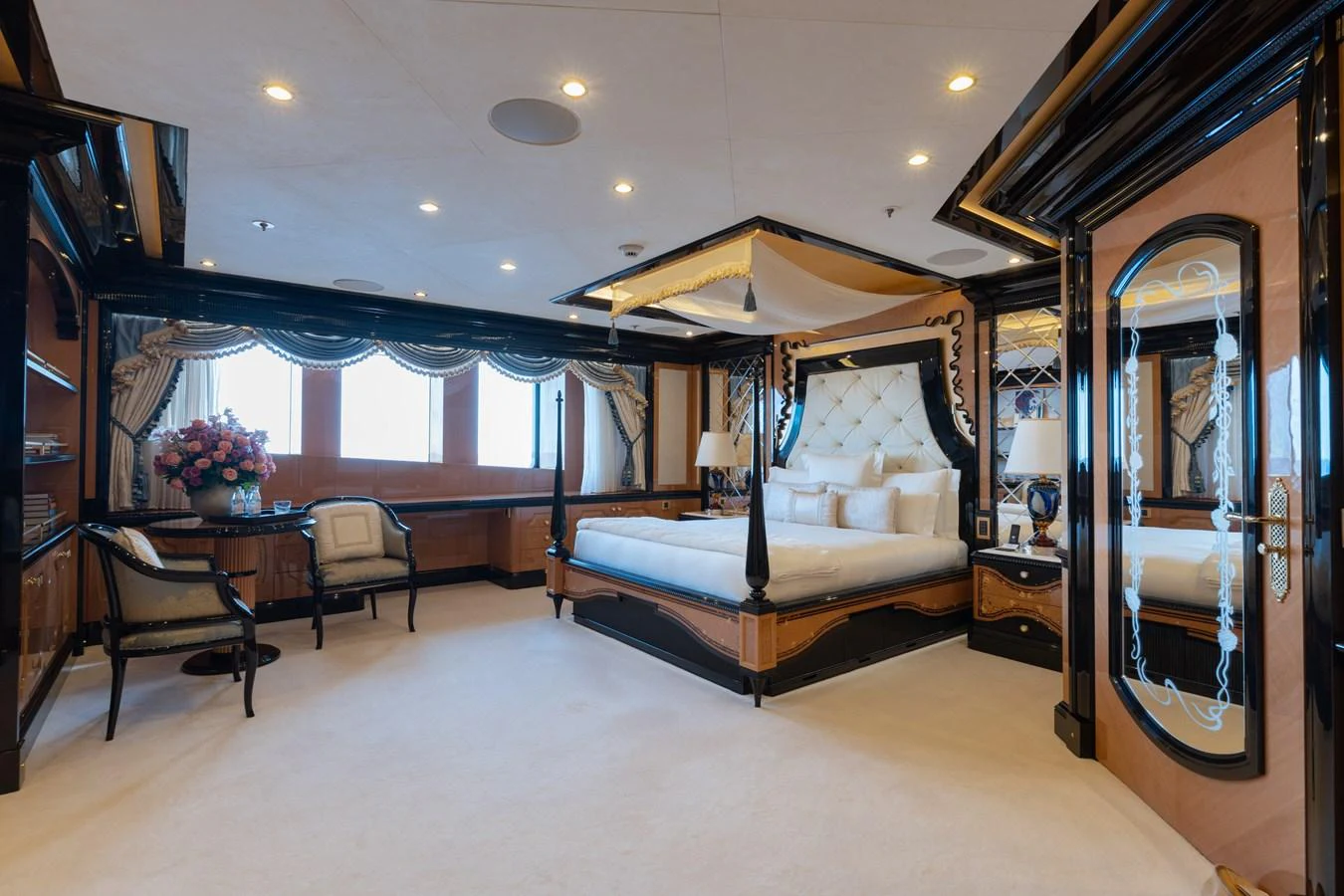 The master stateroom features a luxurious bed with elegant decor and ample natural light. aboard I DYNASTY Yacht for Sale