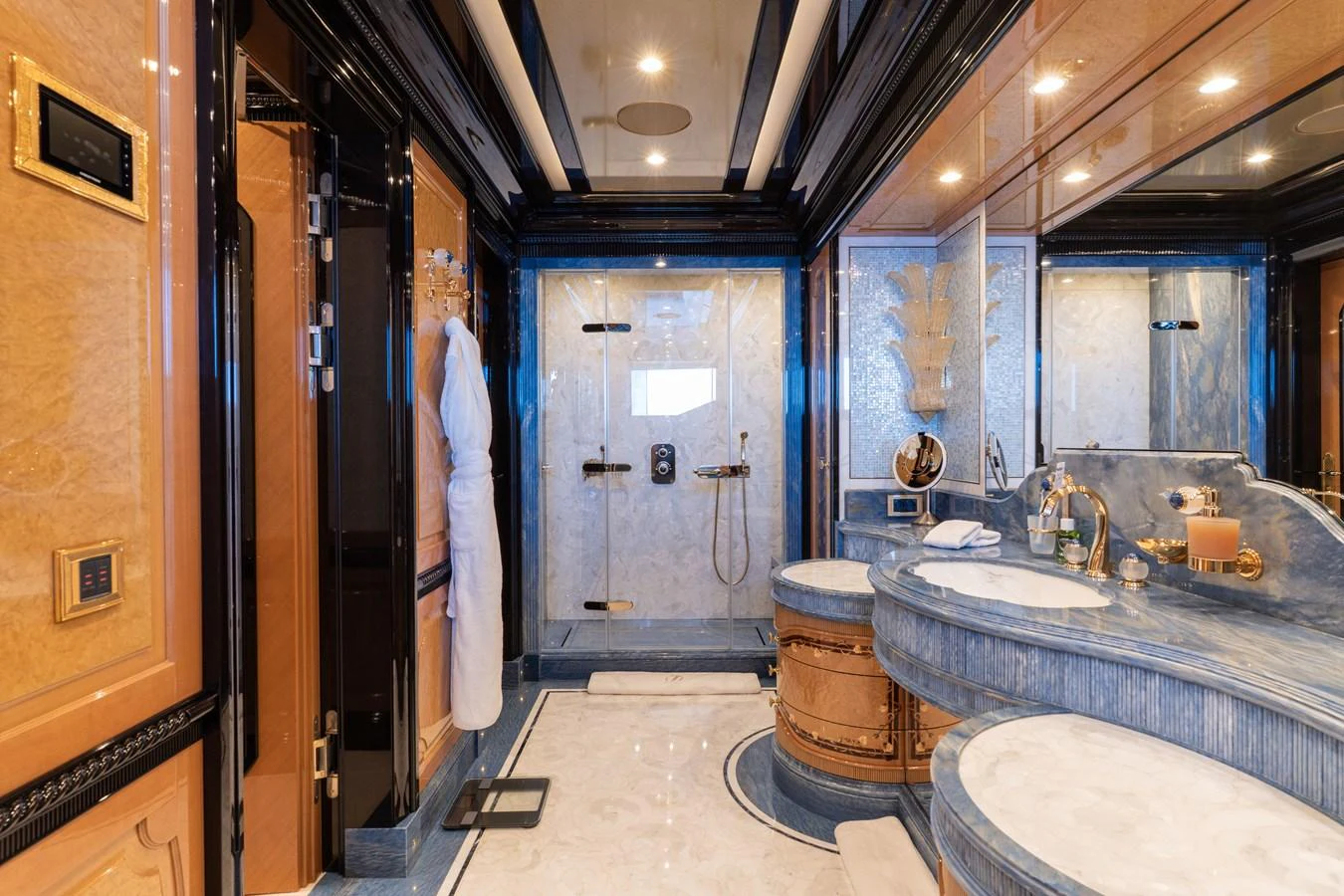 The luxurious bathroom features elegant marble countertops, dual sinks, and a spacious shower area. aboard I DYNASTY Yacht for Sale