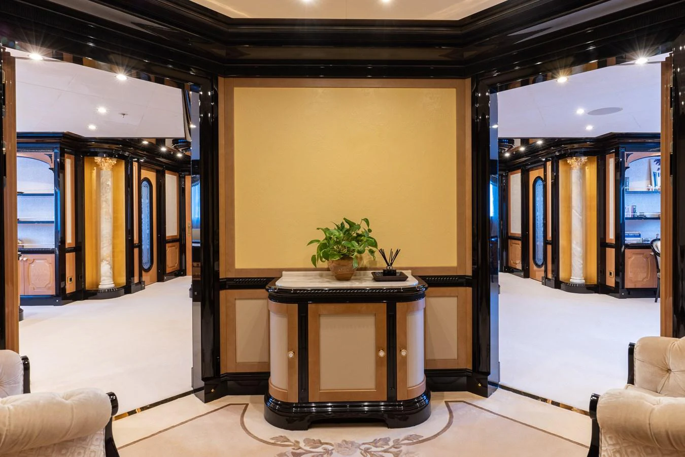 The luxurious interior features elegant decor with a central console and plush seating. aboard I DYNASTY Yacht for Sale