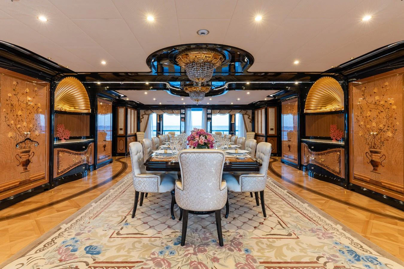 The luxurious dining room features elegant decor and a spacious table set for an exquisite dining experience. aboard I DYNASTY Yacht for Sale
