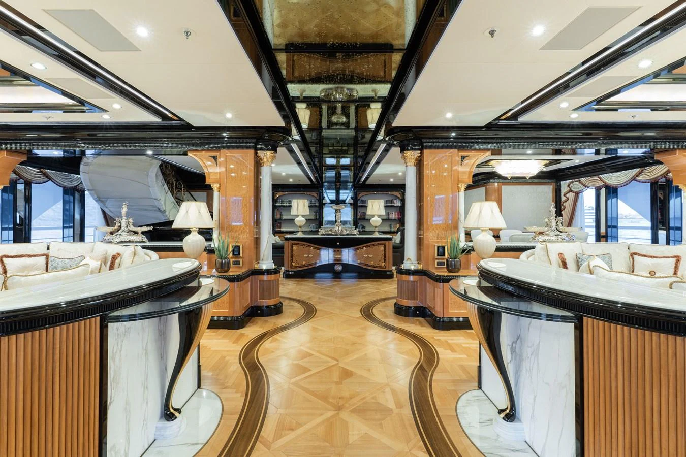 The yacht's interior features an opulent and spacious main salon with luxurious furnishings and elegant decor. aboard I DYNASTY Yacht for Sale