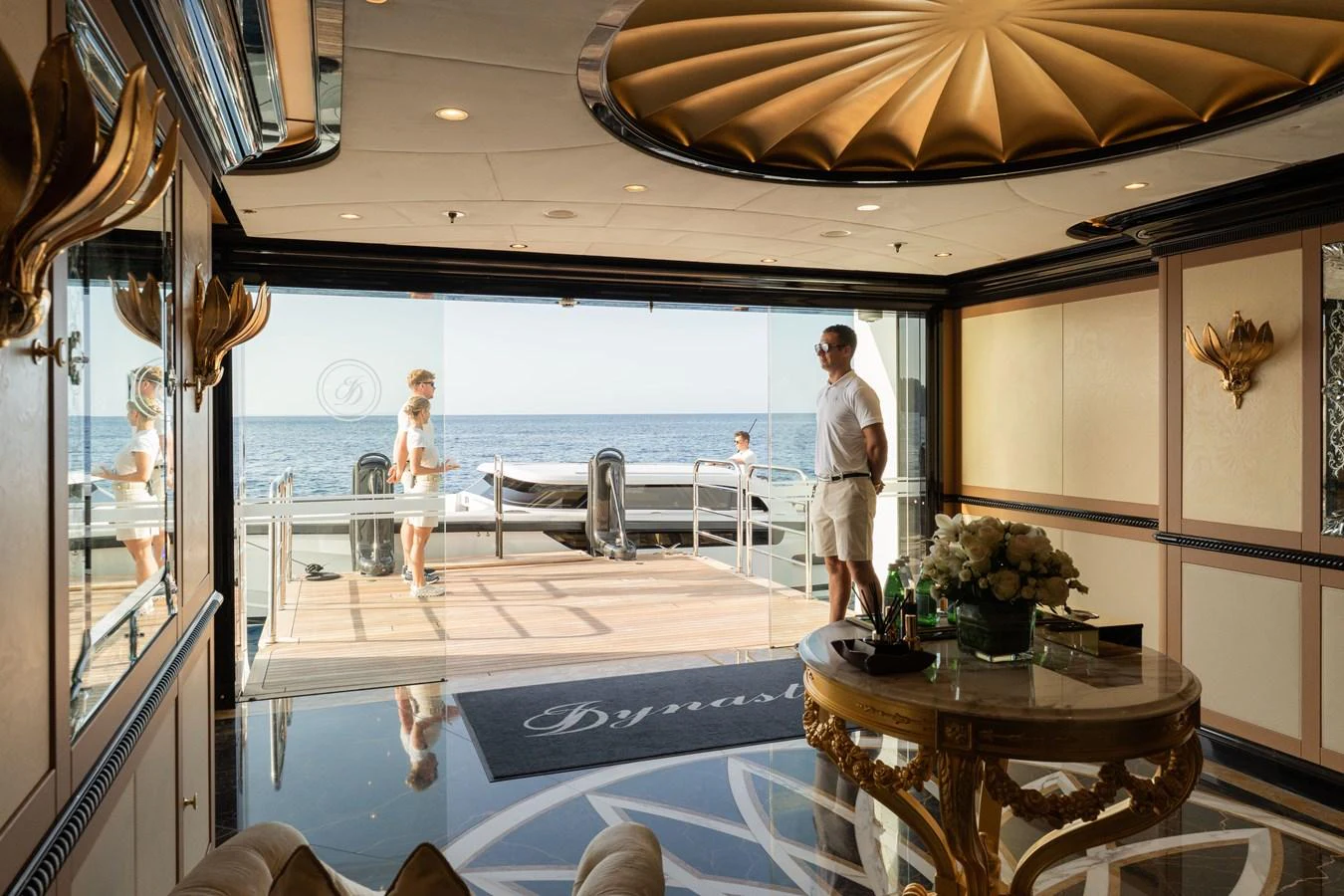 The luxurious interior opens up to a stunning view of the sea, blending elegance with a seamless indoor-outdoor experience. aboard I DYNASTY Yacht for Sale