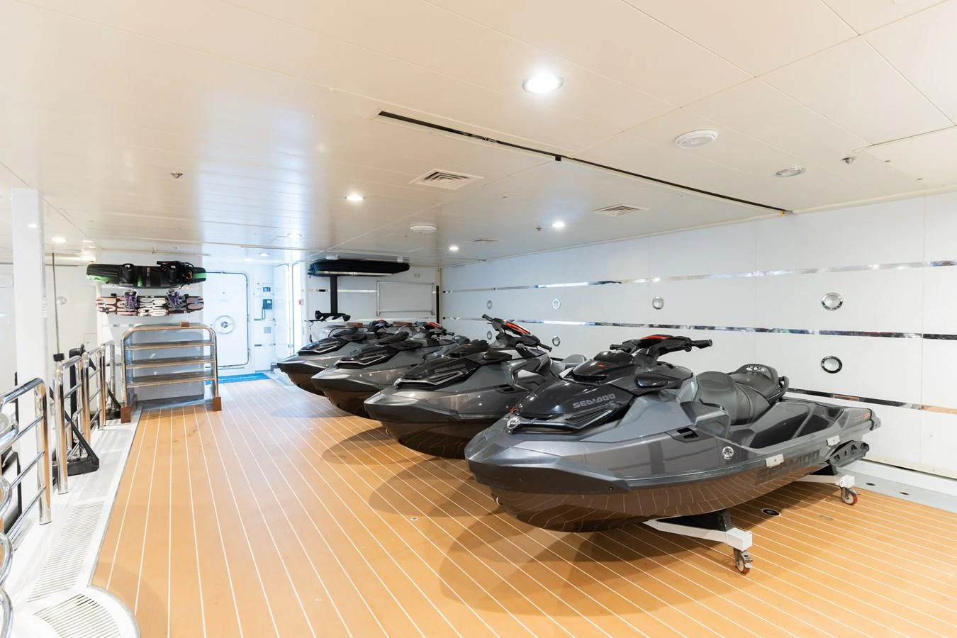 The yacht's garage features multiple jet skis ready for adventure. aboard I DYNASTY Yacht for Sale