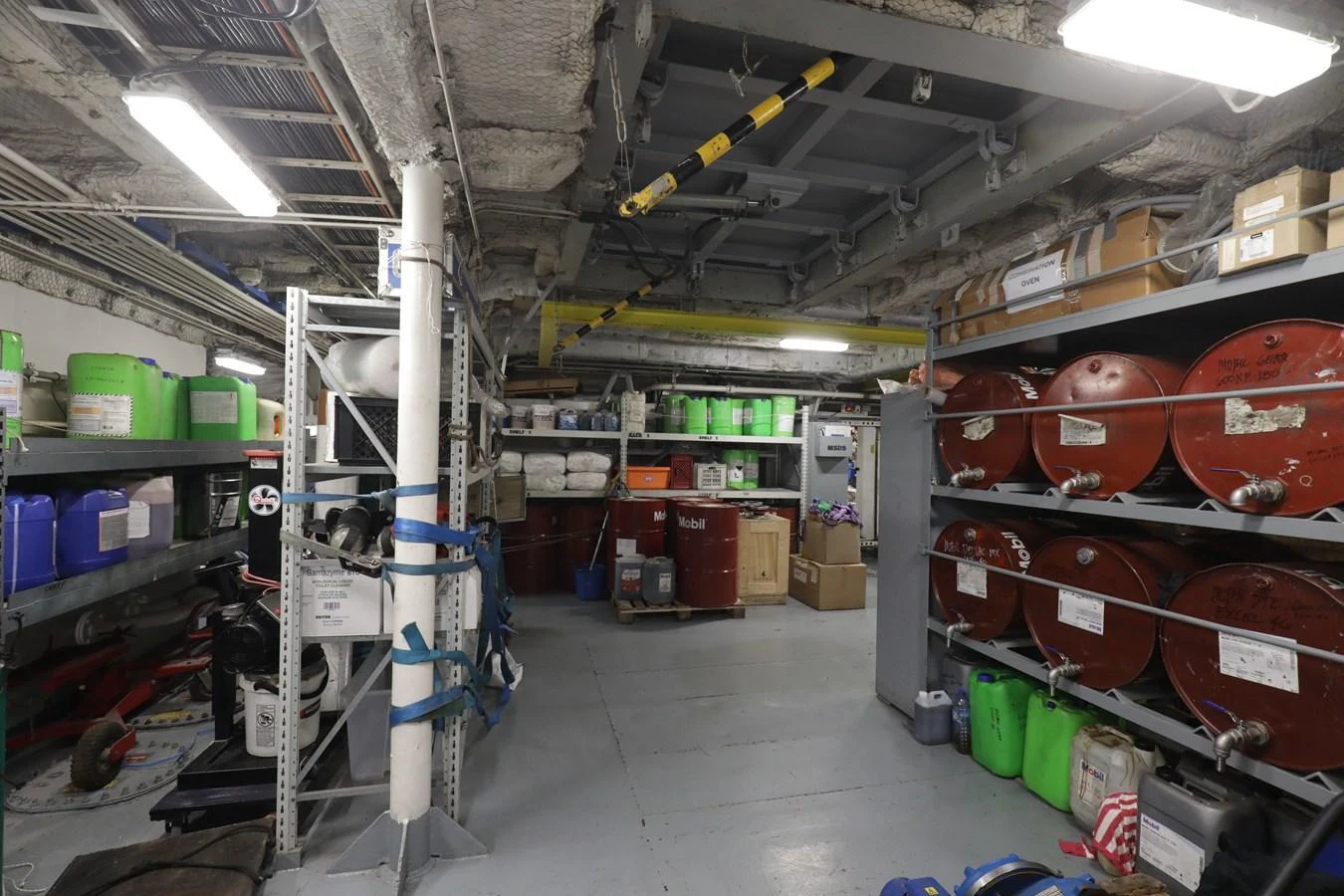 The image shows a well-organized storage and maintenance area within the yacht, featuring various equipment and supplies. aboard SKY Yacht for Sale