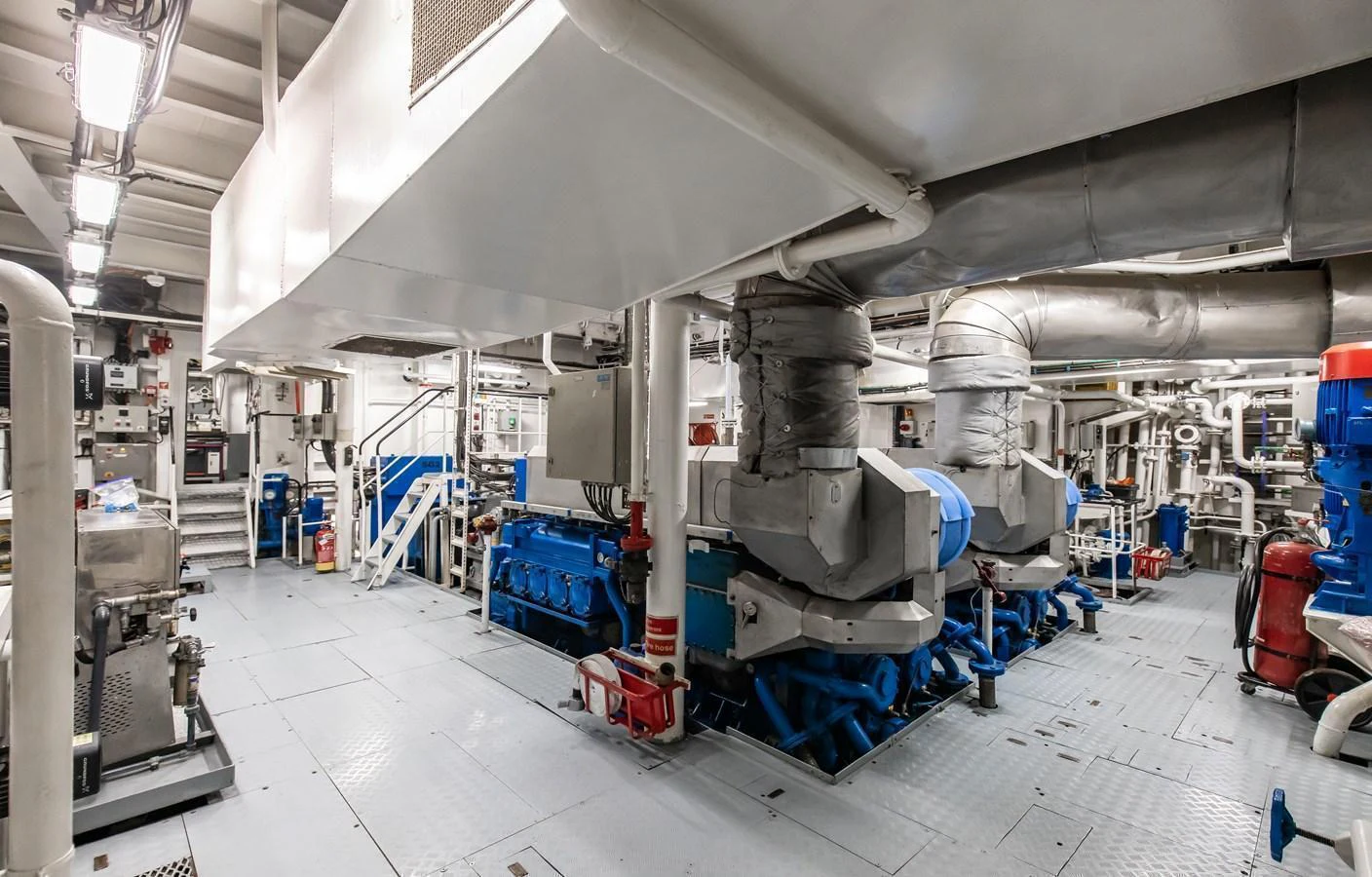 The yacht's engine room showcases advanced machinery and a well-organized layout. aboard SKY Yacht for Sale