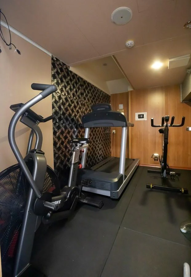The yacht features a well-equipped gym with modern exercise machines. aboard SKY Yacht for Sale