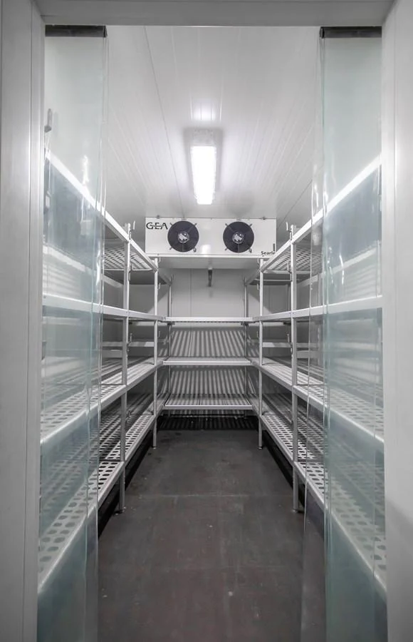 The yacht features a spacious cold storage area with ample shelving for provisions. aboard SKY Yacht for Sale