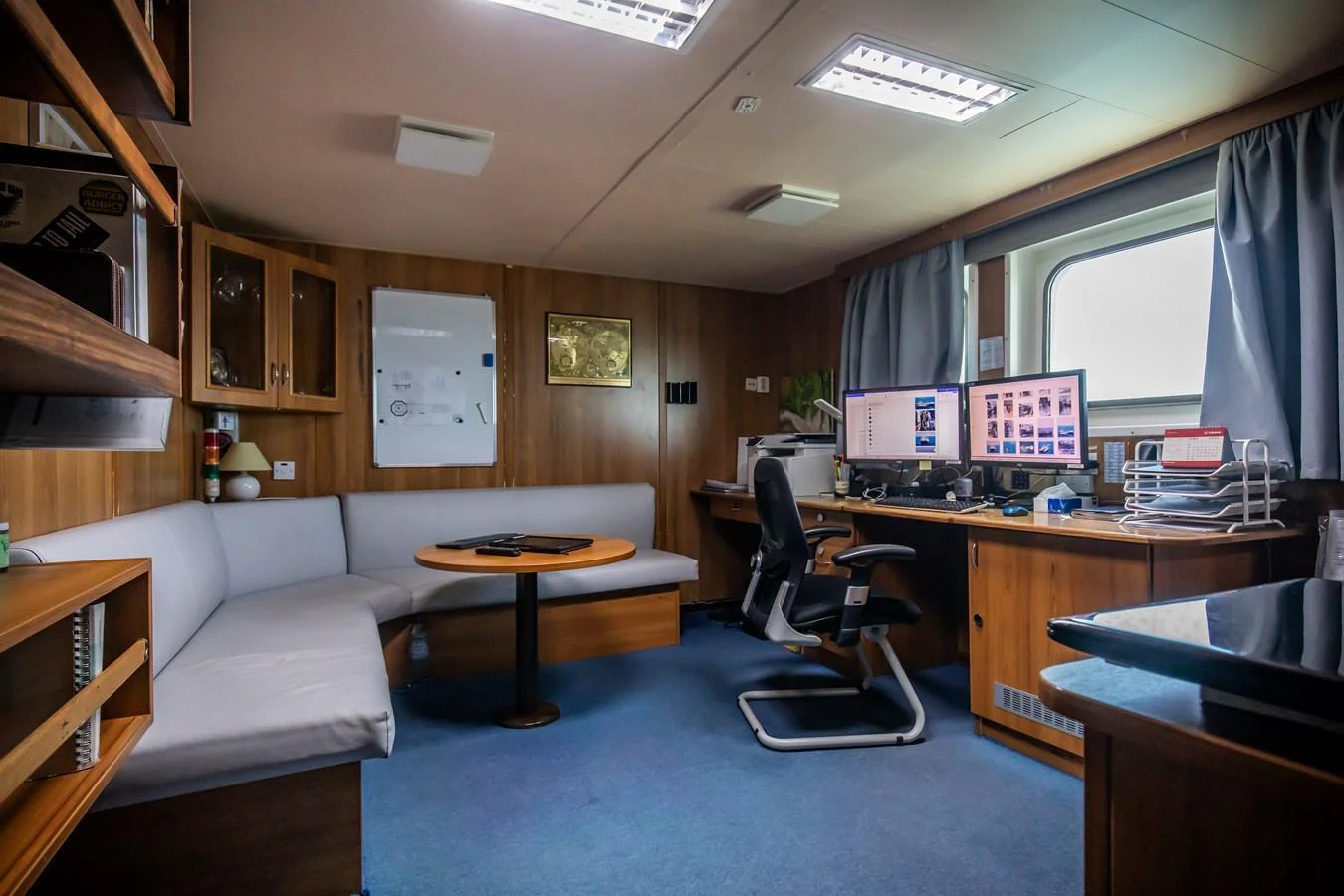 The yacht's office space is equipped with modern amenities and comfortable seating, perfect for work or relaxation. aboard SKY Yacht for Sale