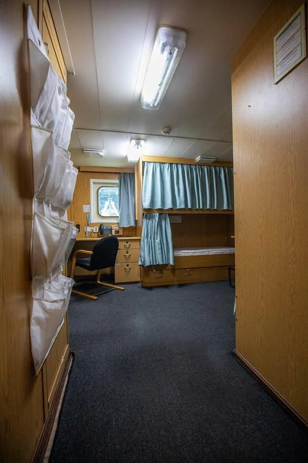 The crew quarters feature practical furnishings and ample storage space. aboard SKY Yacht for Sale