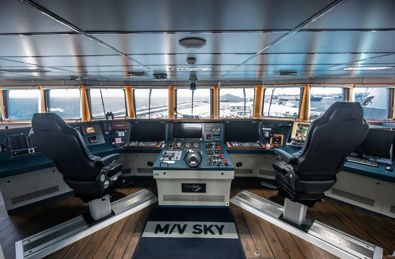The helm of the yacht features advanced navigation equipment and comfortable seating for the captain and crew. aboard SKY Yacht for Sale