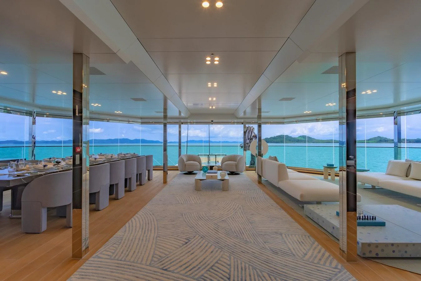 The spacious salon offers panoramic views and luxurious seating, perfect for relaxation and socializing. aboard WANDERLUST Yacht for Sale