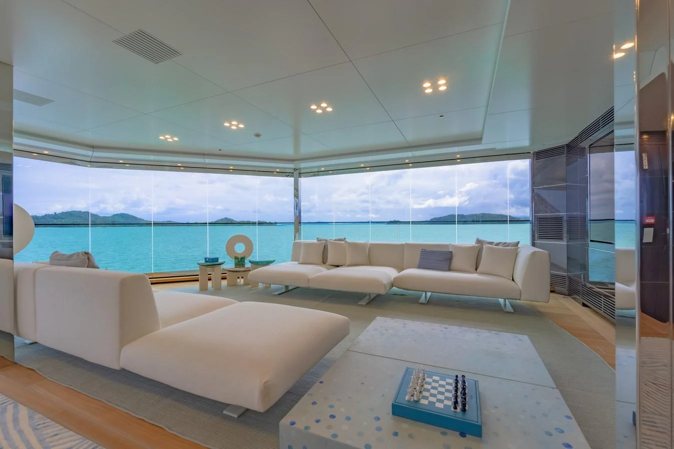 The salon offers a serene and luxurious space with panoramic ocean views. aboard WANDERLUST Yacht for Sale