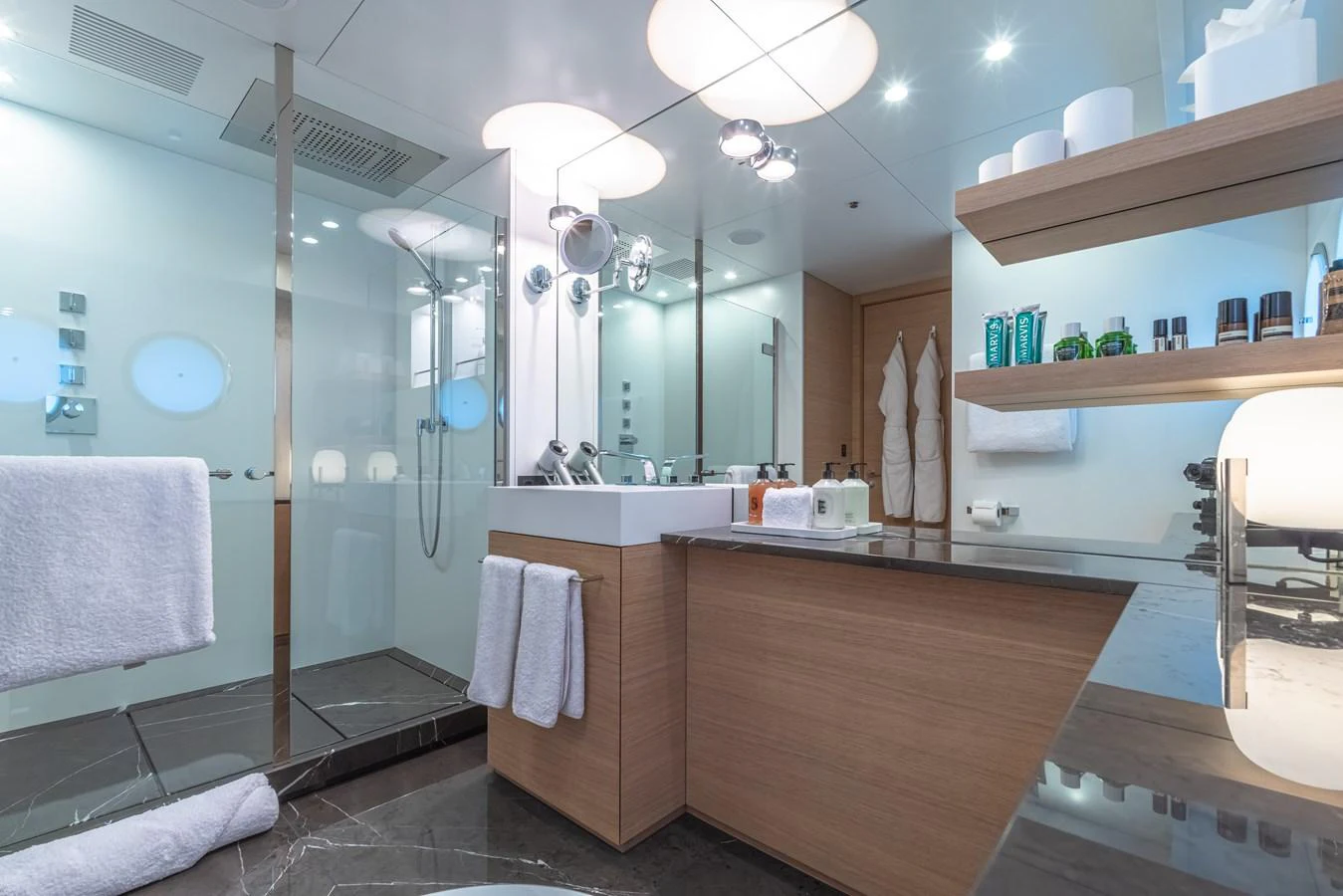 A luxurious yacht bathroom featuring modern fixtures and ample amenities. aboard WANDERLUST Yacht for Sale