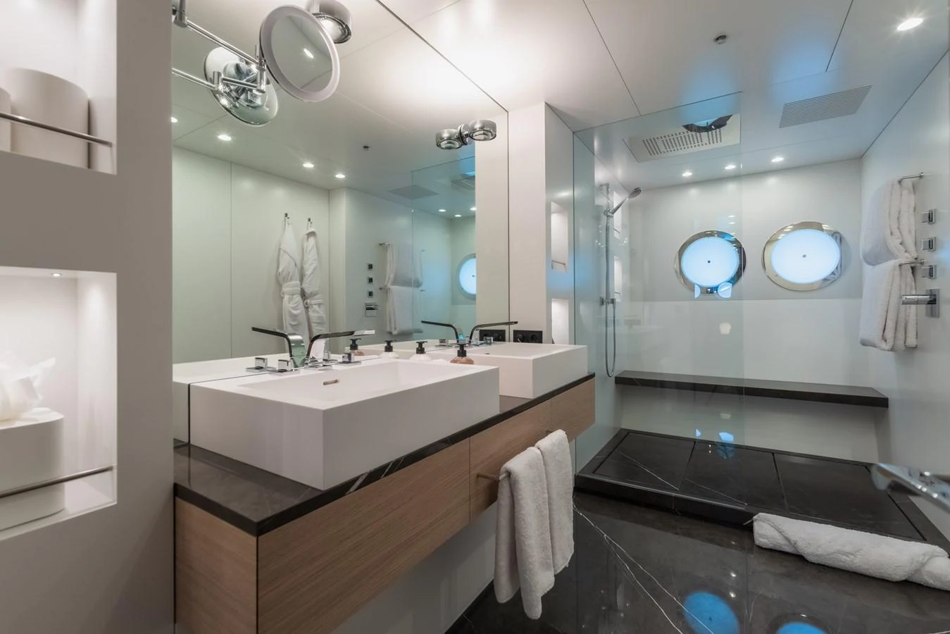 The yacht's bathroom features modern fixtures and a luxurious shower area. aboard WANDERLUST Yacht for Sale