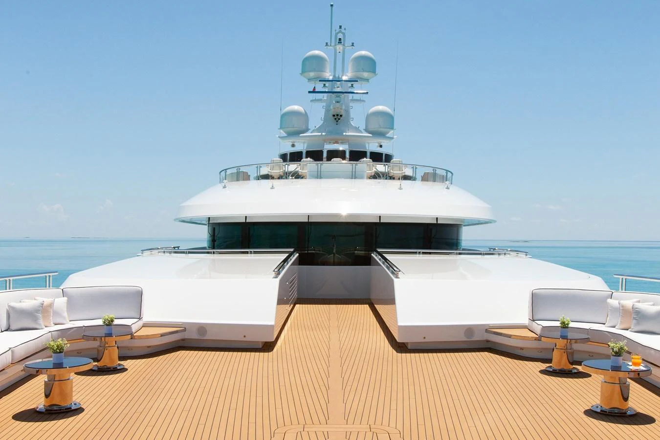The yacht's foredeck features elegant seating areas with a stunning view of the open sea. aboard BOARDWALK V Yacht for Sale