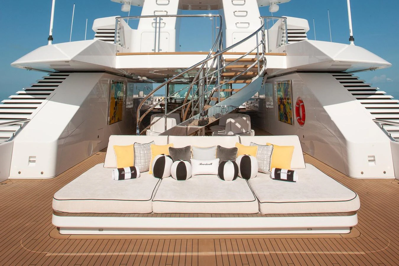 The sundeck features luxurious lounging areas with plush cushions and stylish decor. aboard BOARDWALK V Yacht for Sale