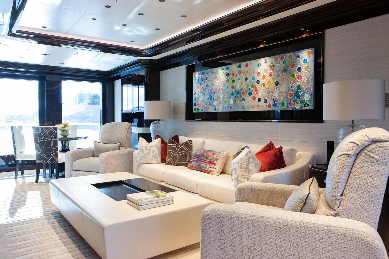 The yacht's salon features plush seating, modern decor, and ample natural light. aboard BOARDWALK V Yacht for Sale
