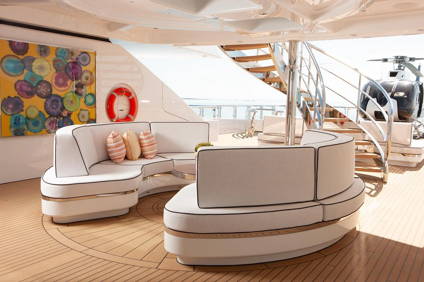 The aft deck features stylish seating with a modern design, perfect for relaxation and socializing. aboard BOARDWALK V Yacht for Sale