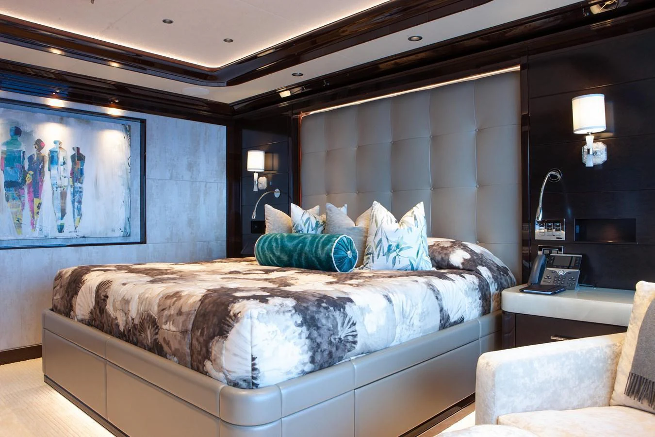 The master stateroom features a luxurious bed with plush pillows and modern decor. aboard BOARDWALK V Yacht for Sale