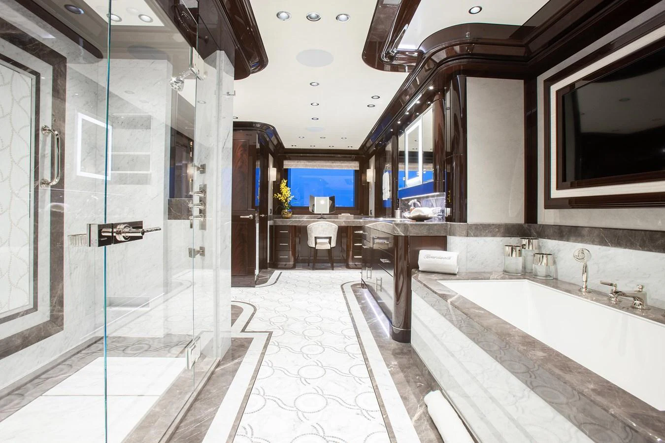 The luxurious bathroom features a spacious layout with elegant fixtures and a sophisticated design. aboard BOARDWALK V Yacht for Sale