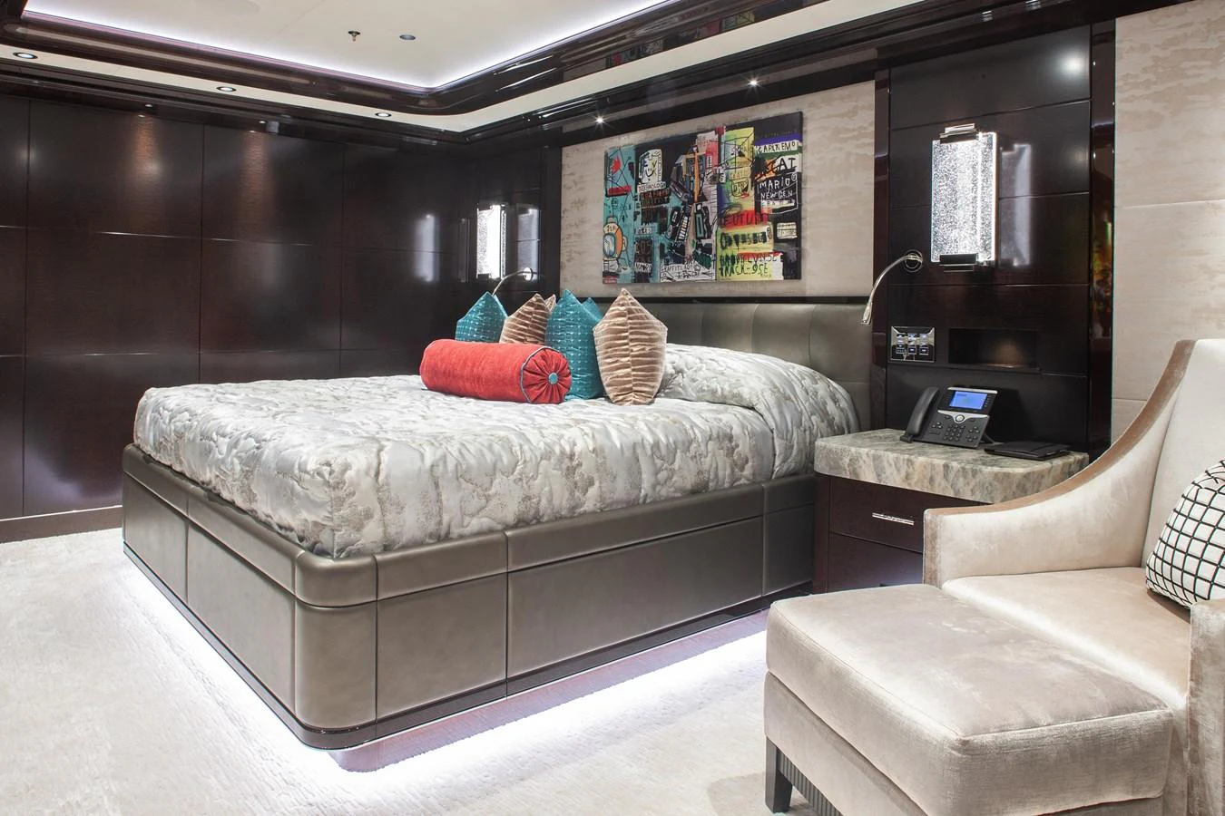 The master stateroom features a luxurious bed with plush pillows and modern decor. aboard BOARDWALK V Yacht for Sale