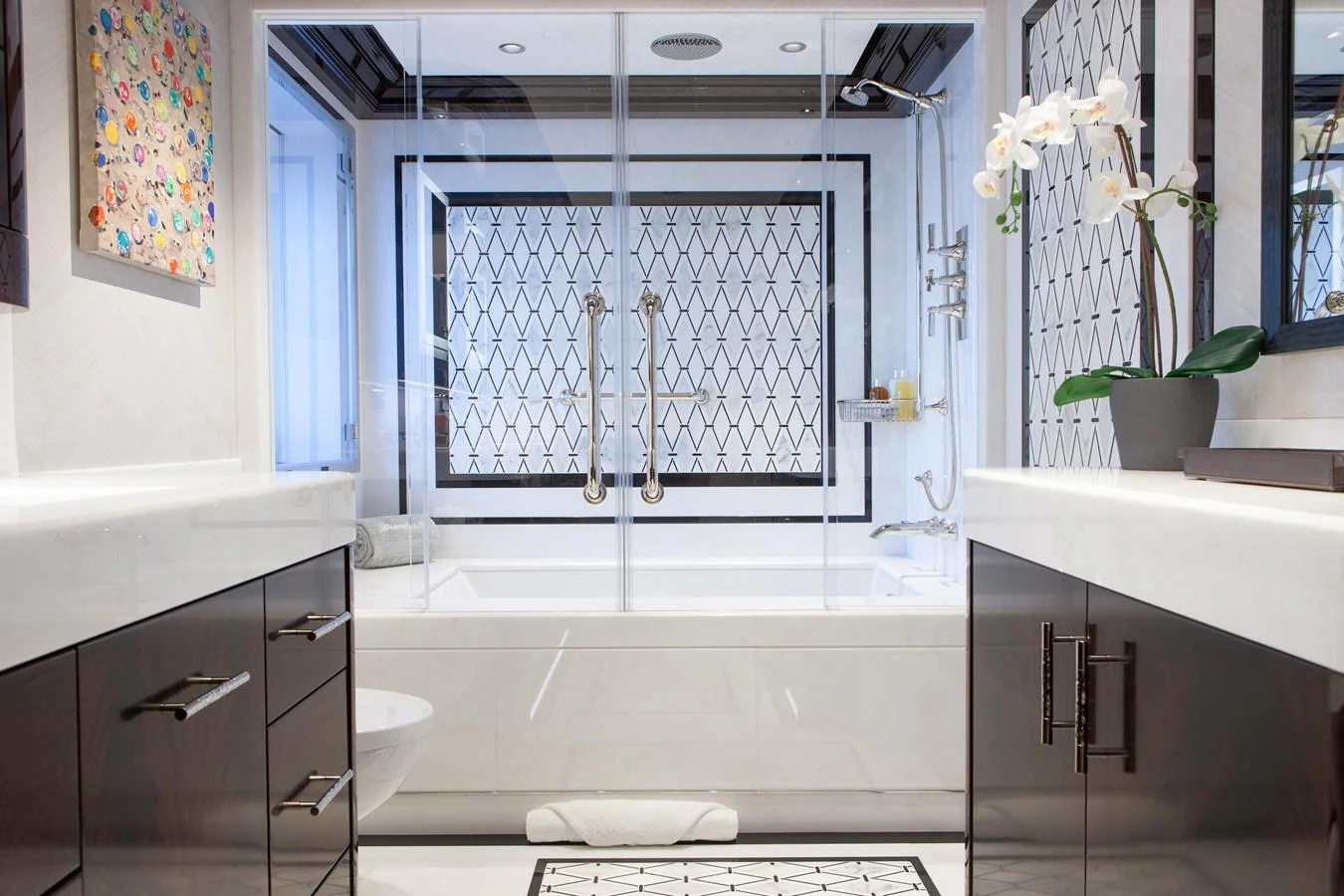 A luxurious yacht bathroom featuring modern fixtures and elegant design. aboard BOARDWALK V Yacht for Sale
