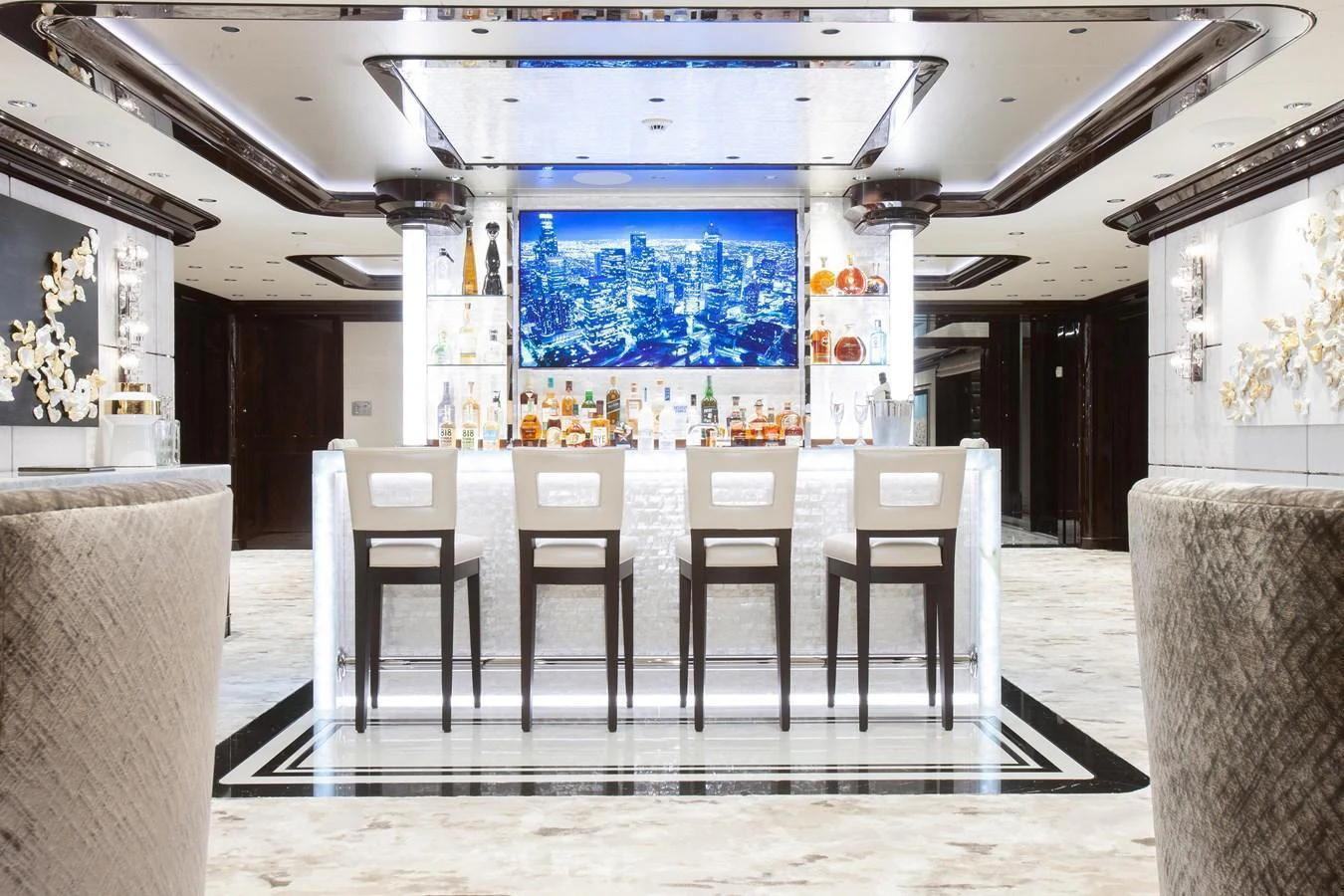 The yacht's interior features a luxurious bar area with a sleek, modern design. aboard BOARDWALK V Yacht for Sale