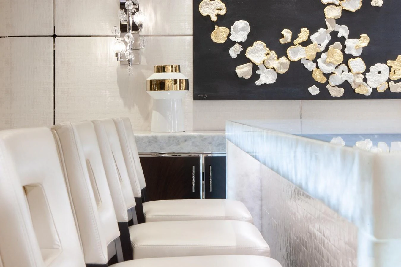 The yacht's interior features a sophisticated seating area with plush white chairs and elegant decor. aboard BOARDWALK V Yacht for Sale