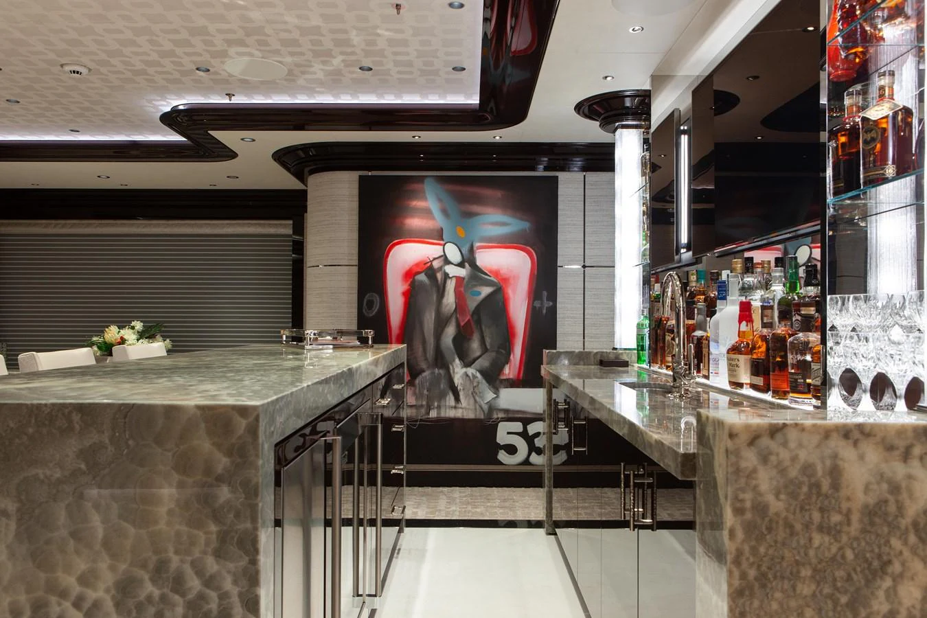 The yacht's interior features a sophisticated bar area with a modern design and a well-stocked selection of spirits. aboard BOARDWALK V Yacht for Sale