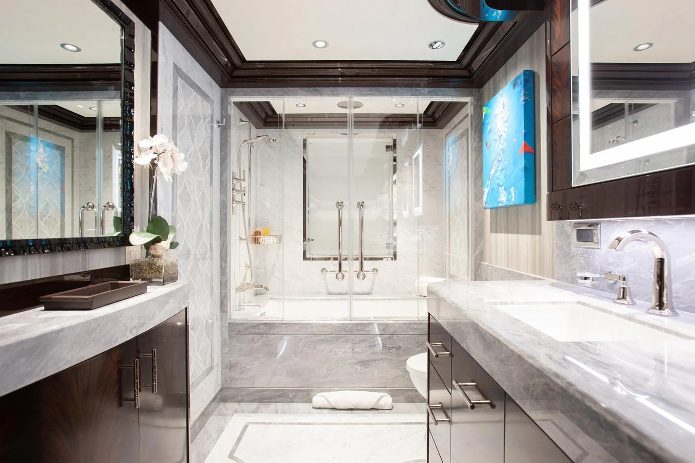 The luxurious bathroom features elegant marble surfaces and modern fixtures. aboard BOARDWALK V Yacht for Sale