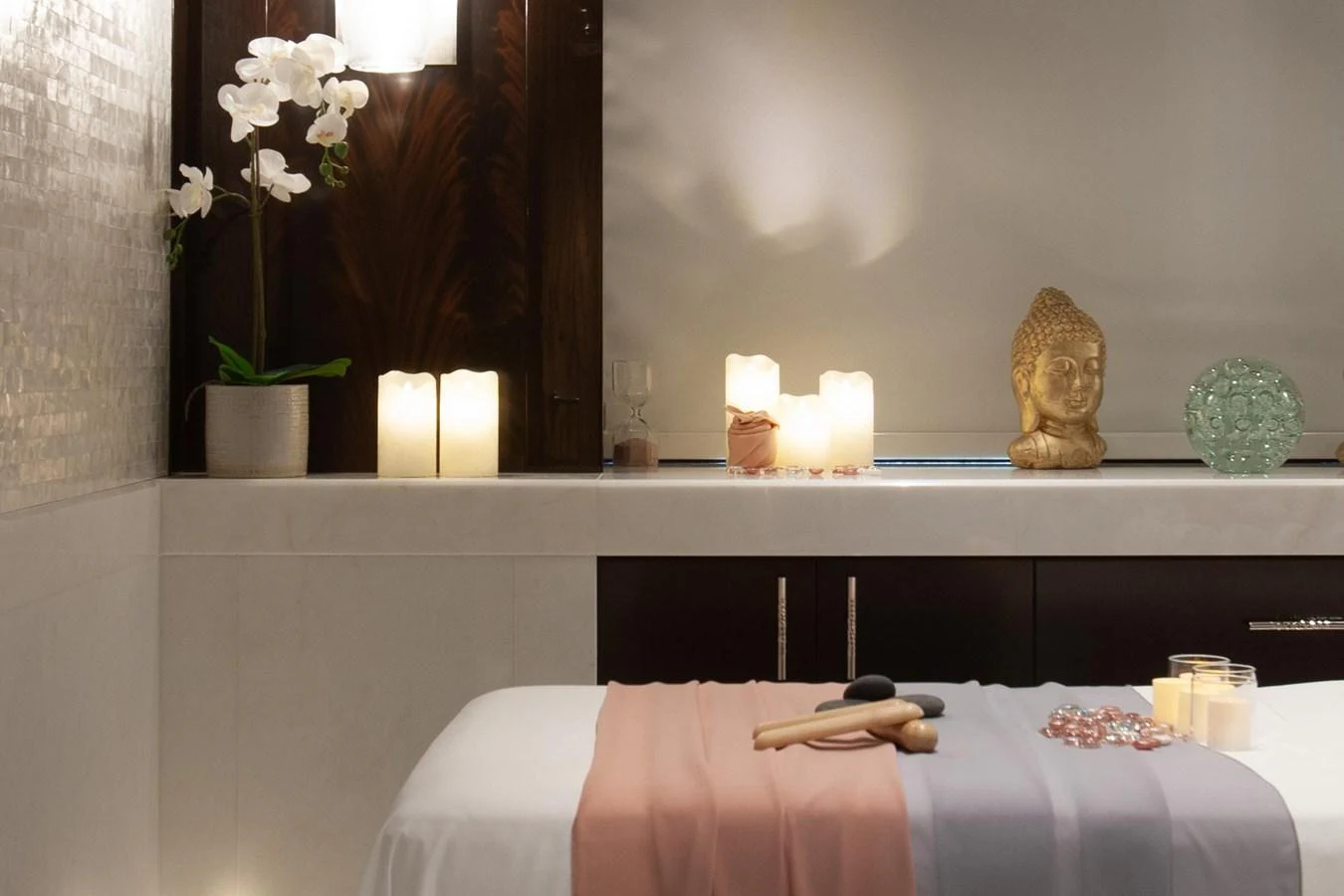 A serene spa room with soft lighting and elegant decor. aboard BOARDWALK V Yacht for Sale