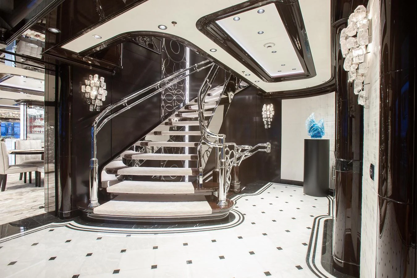 A luxurious yacht interior featuring an elegant staircase with modern design elements. aboard BOARDWALK V Yacht for Sale