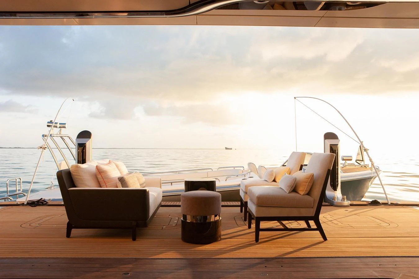 The aft deck offers a luxurious lounging area with comfortable seating and stunning ocean views. aboard BOARDWALK V Yacht for Sale