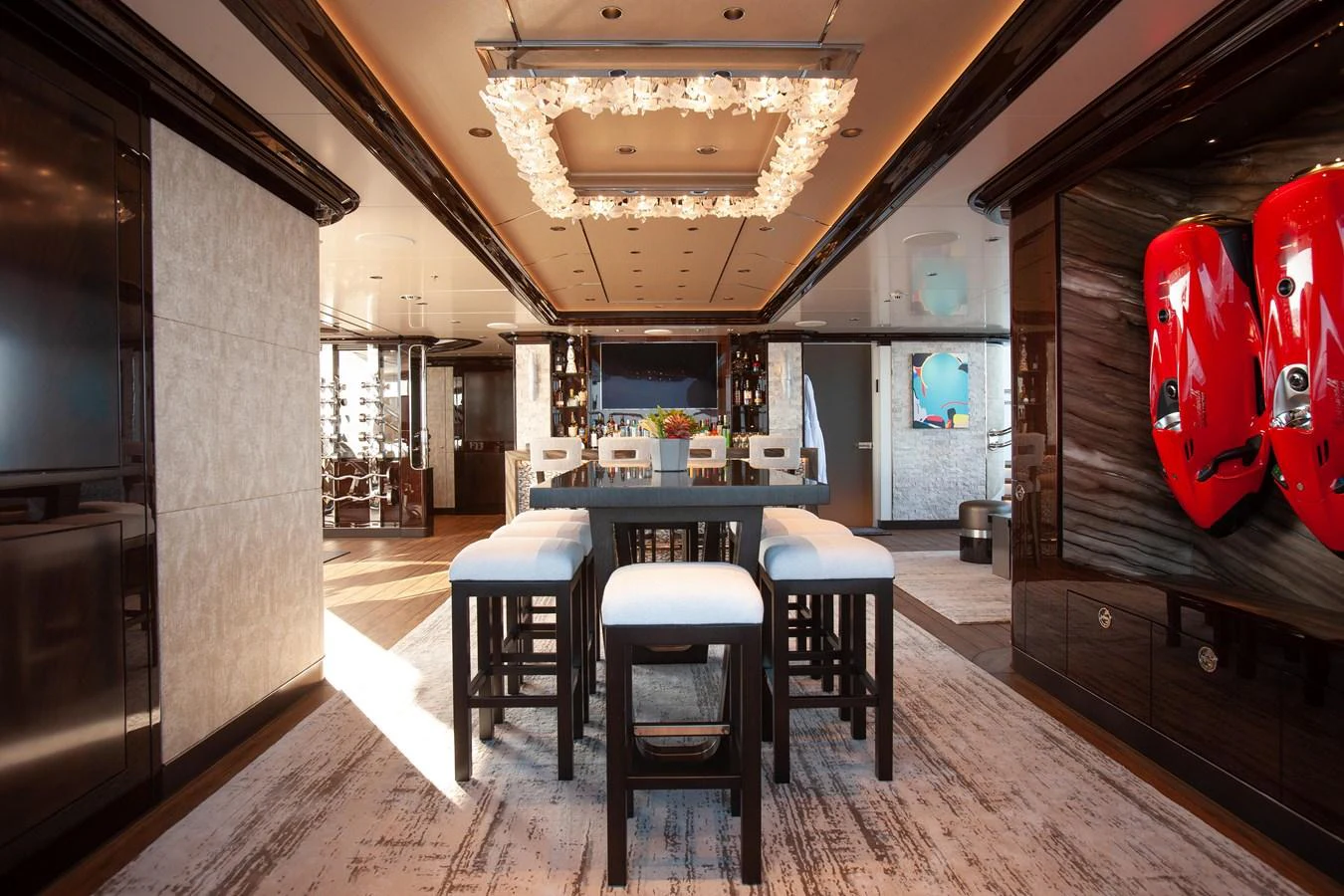 The yacht's interior features a luxurious dining area with elegant lighting and modern decor. aboard BOARDWALK V Yacht for Sale