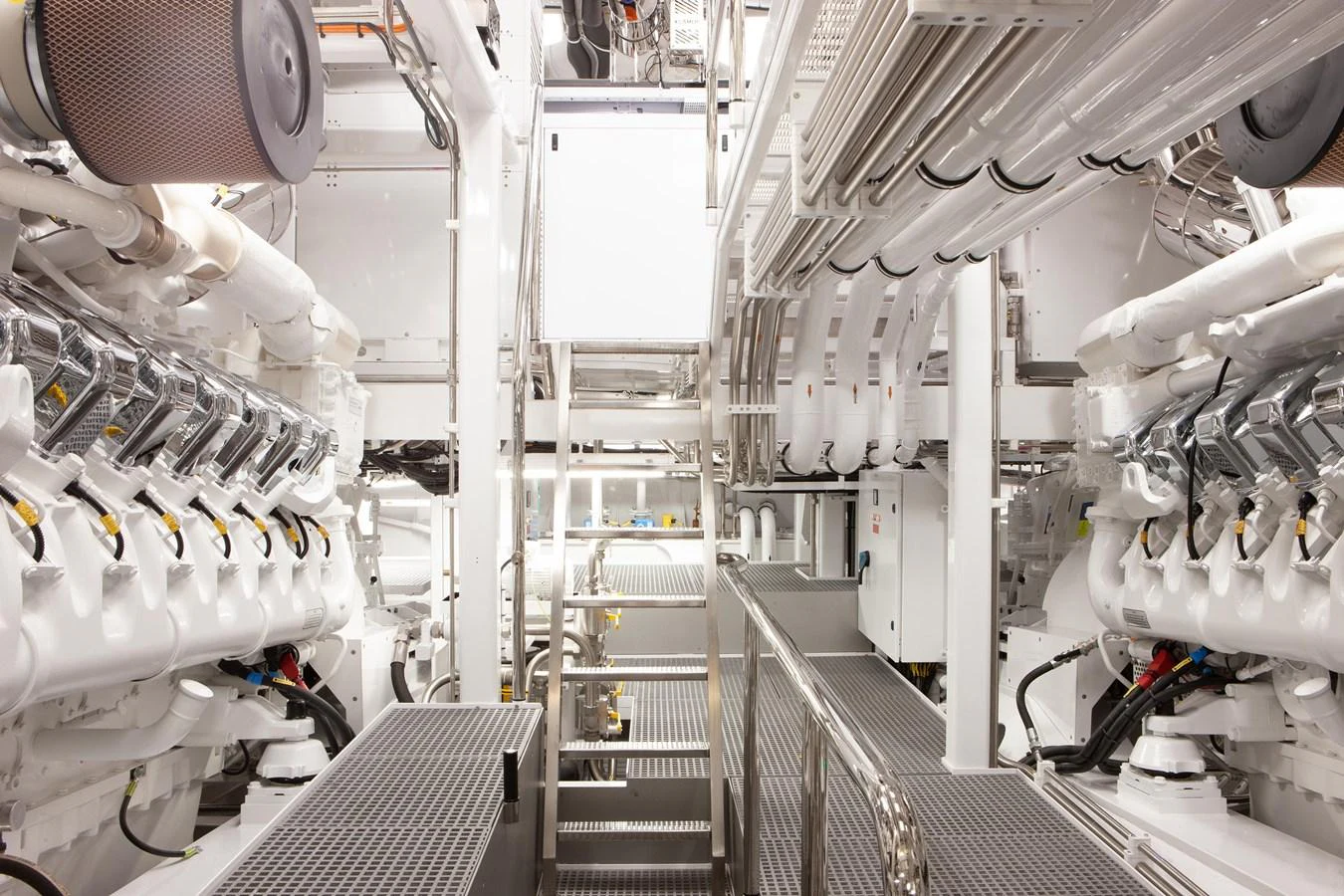 The image showcases the pristine and well-organized engine room of the yacht, highlighting its advanced engineering. aboard BOARDWALK V Yacht for Sale
