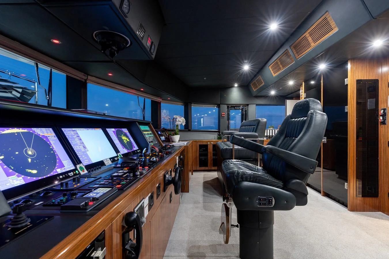 The helm station features advanced navigation equipment and luxurious seating for optimal control and comfort. aboard ETERNITY Yacht for Sale
