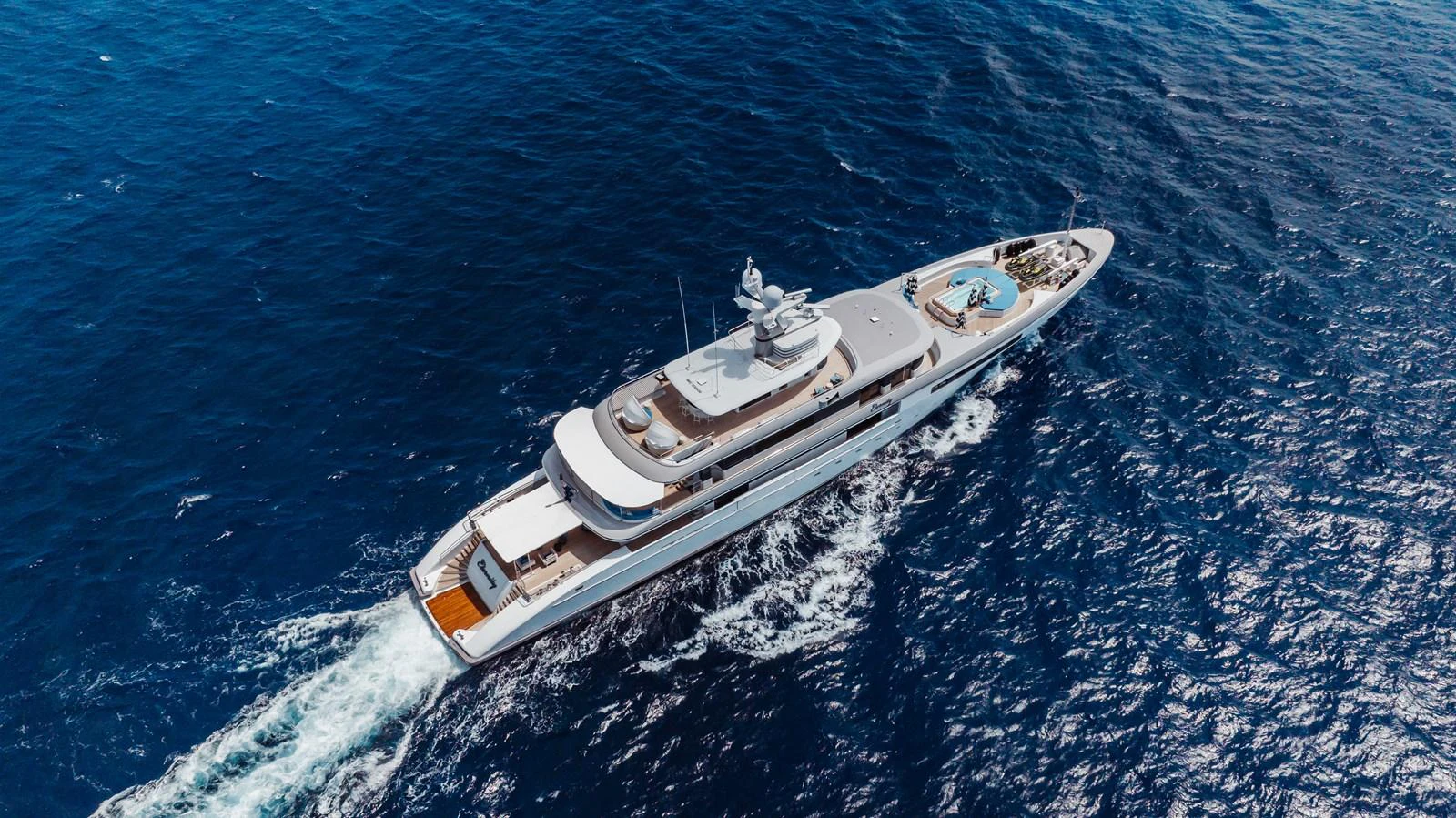 A luxurious yacht cruises through the open sea, showcasing its elegant design and spacious decks. aboard ETERNITY Yacht for Sale