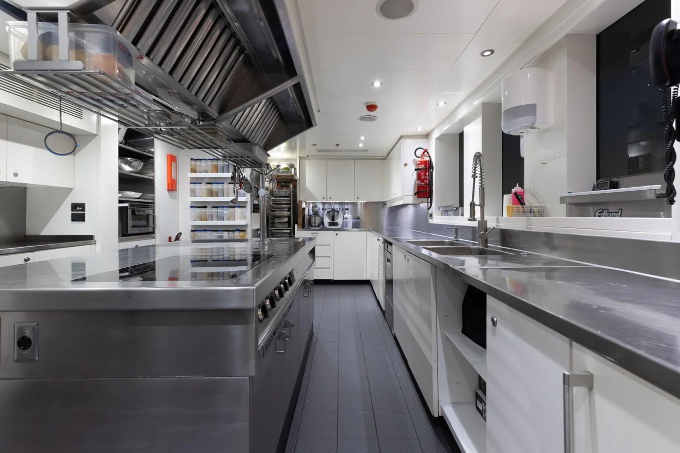 The yacht's galley is equipped with professional-grade stainless steel appliances and ample counter space. aboard ETERNITY Yacht for Sale
