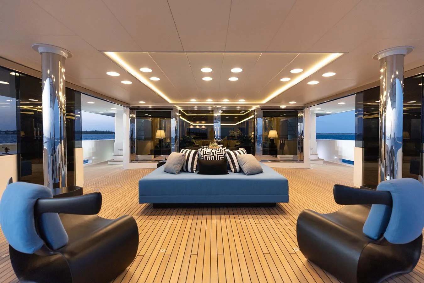 The yacht's salon features a spacious and elegantly designed seating area with modern furnishings and ambient lighting. aboard ETERNITY Yacht for Sale