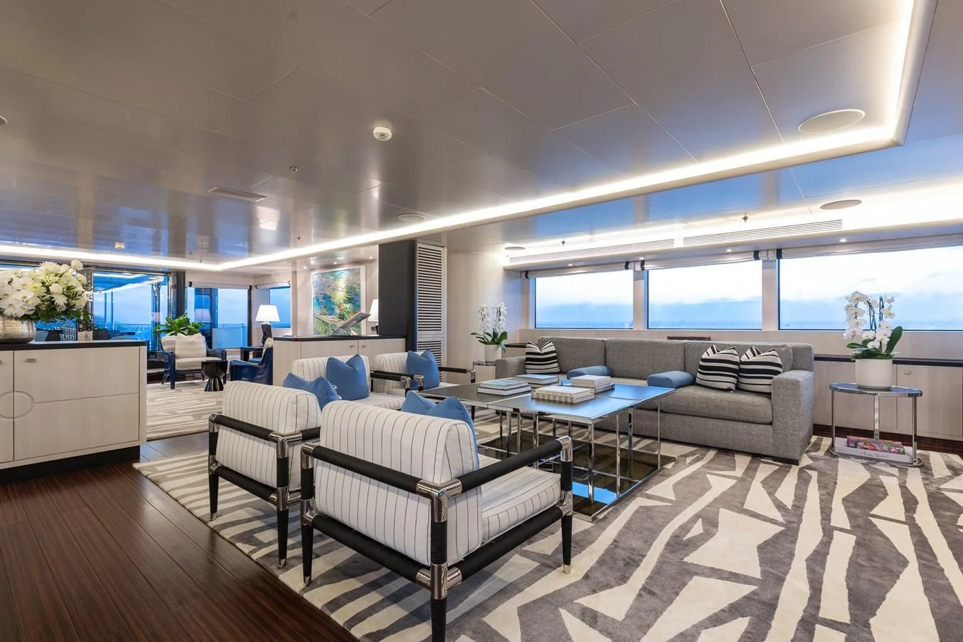 The yacht's salon features a spacious and elegantly designed seating area with panoramic windows. aboard ETERNITY Yacht for Sale