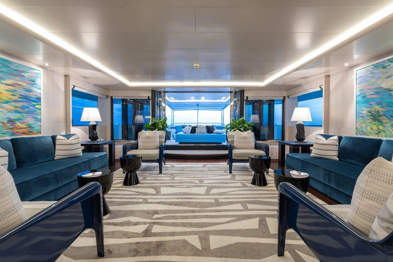 The yacht's salon features luxurious seating, elegant decor, and ample natural light. aboard ETERNITY Yacht for Sale