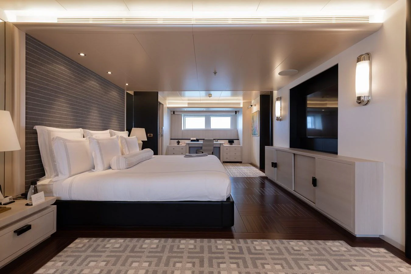 The master stateroom features a spacious layout with elegant furnishings and modern lighting. aboard ETERNITY Yacht for Sale