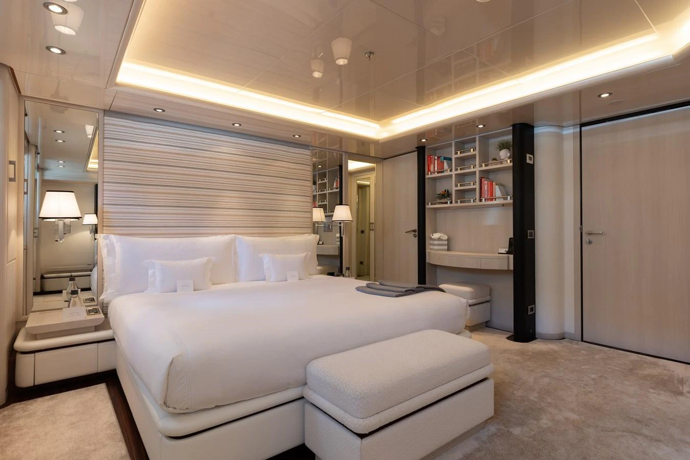 The master stateroom features a luxurious king-size bed, elegant lighting, and ample storage space. aboard ETERNITY Yacht for Sale