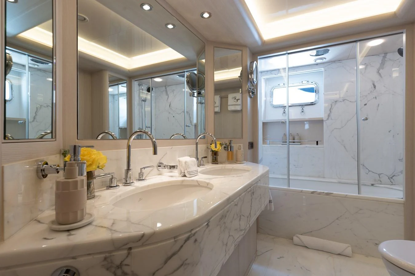 The yacht's bathroom features luxurious marble finishes and modern fixtures. aboard ETERNITY Yacht for Sale