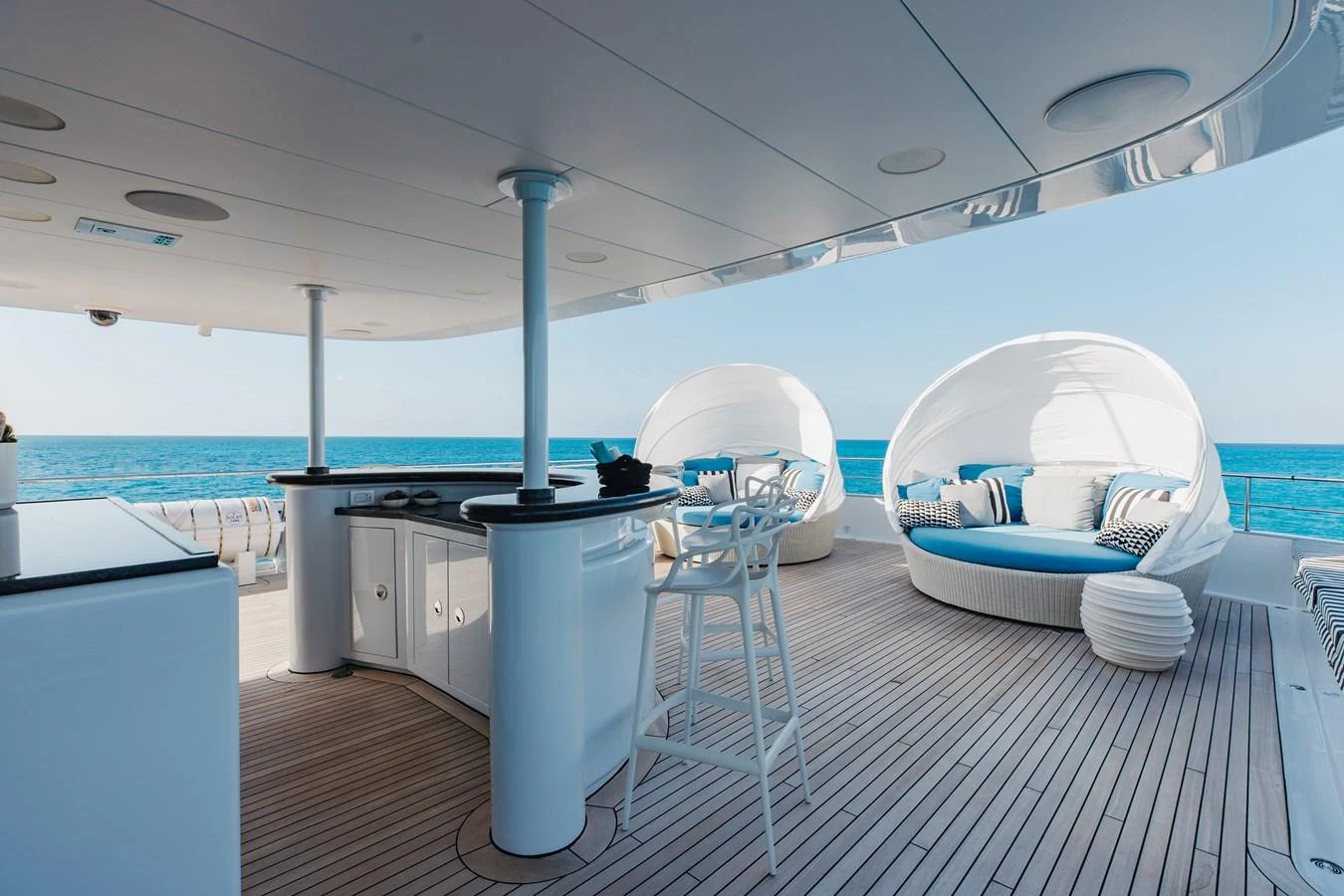 The sundeck features luxurious seating and a well-equipped bar area, perfect for relaxation and entertaining. aboard ETERNITY Yacht for Sale