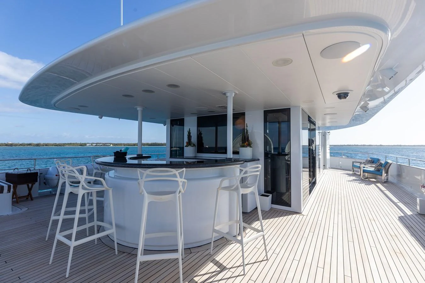 This image showcases a stylish outdoor bar area on the yacht's deck, perfect for socializing and enjoying the sea views. aboard ETERNITY Yacht for Sale