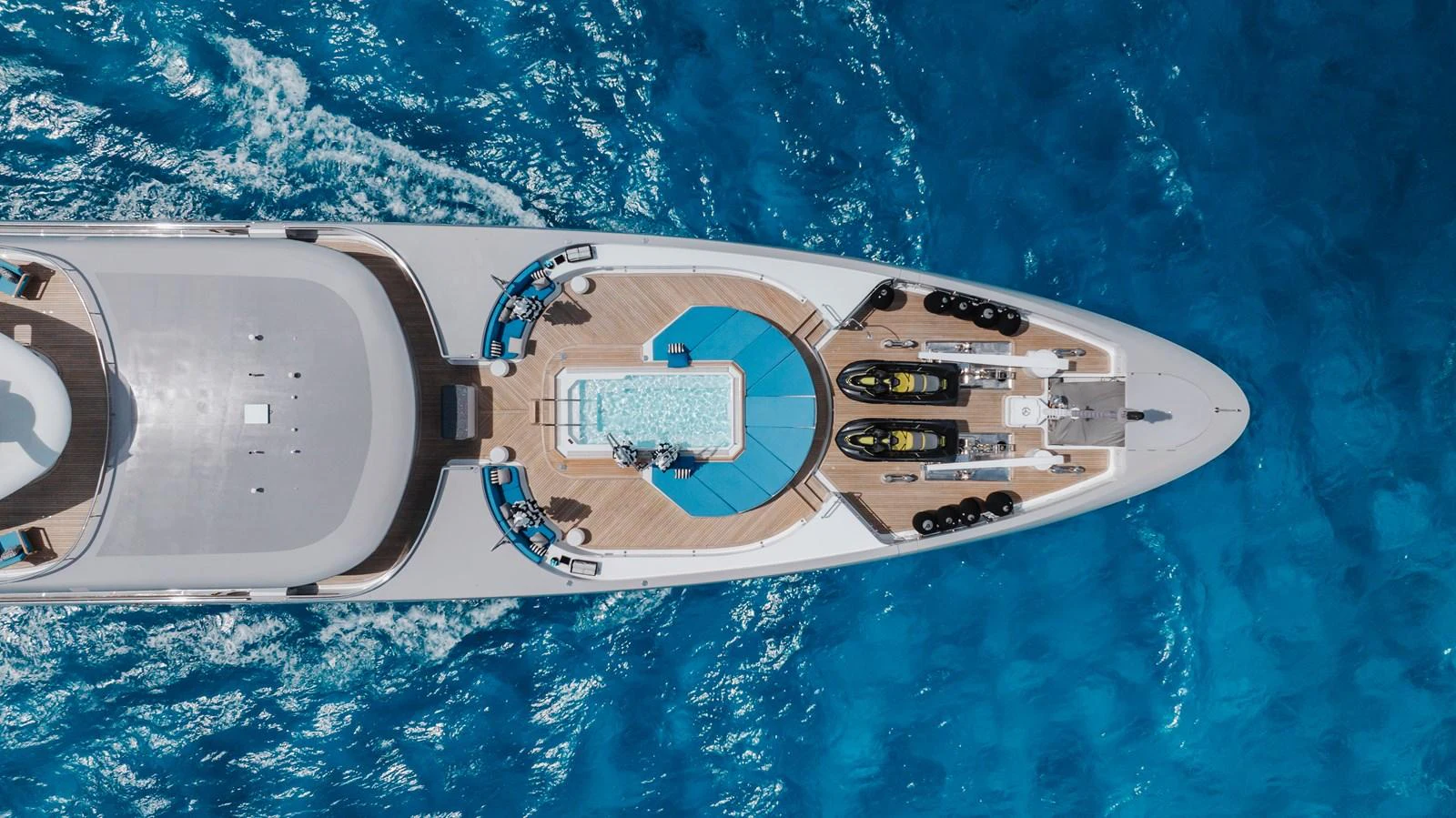 The sundeck of this yacht features a luxurious pool and ample lounging space, perfect for relaxation. aboard ETERNITY Yacht for Sale