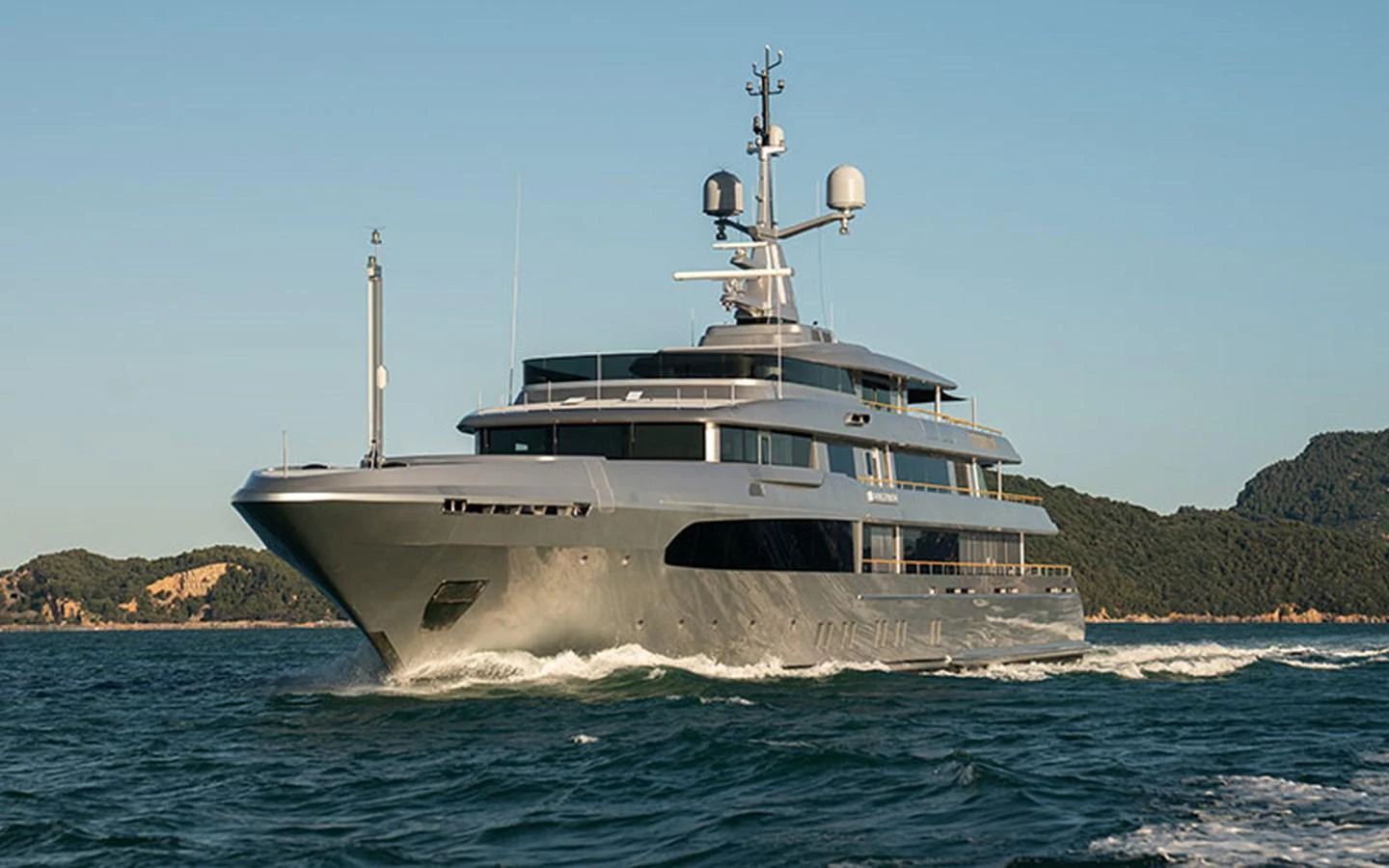 A sleek and modern yacht cruising on the open water with a scenic backdrop. aboard REGINA D'ITALIA Yacht for Sale