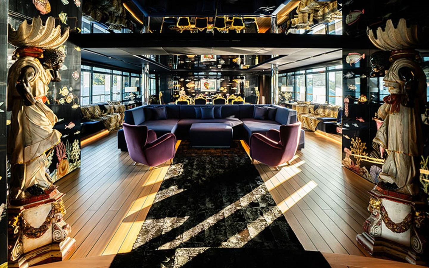 The salon features luxurious seating with opulent decor and ample natural light. aboard REGINA D'ITALIA Yacht for Sale