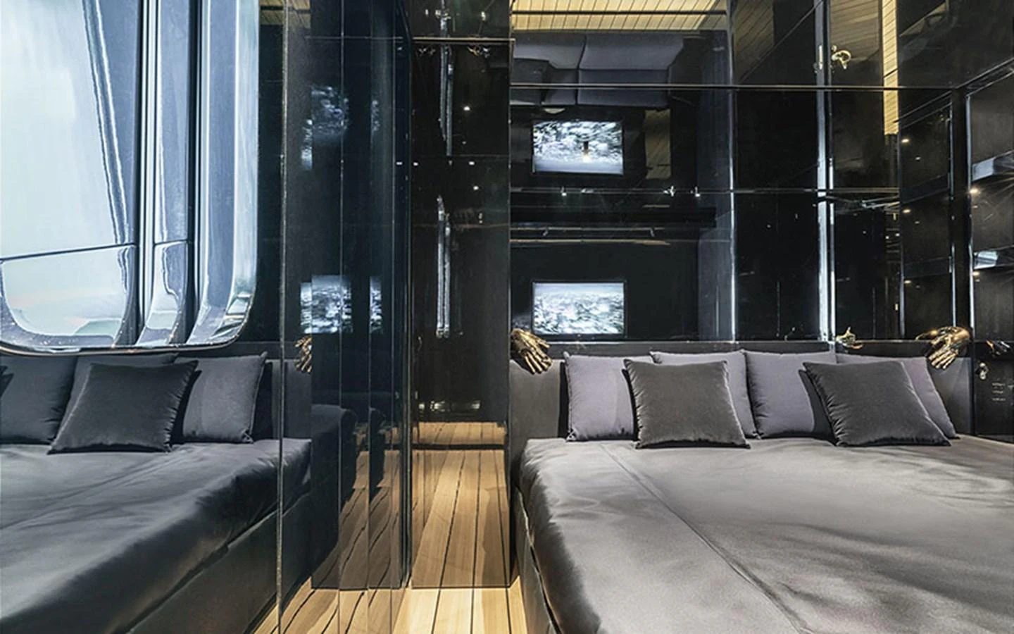 The stateroom features sleek, modern design with dark tones and luxurious bedding. aboard REGINA D'ITALIA Yacht for Sale